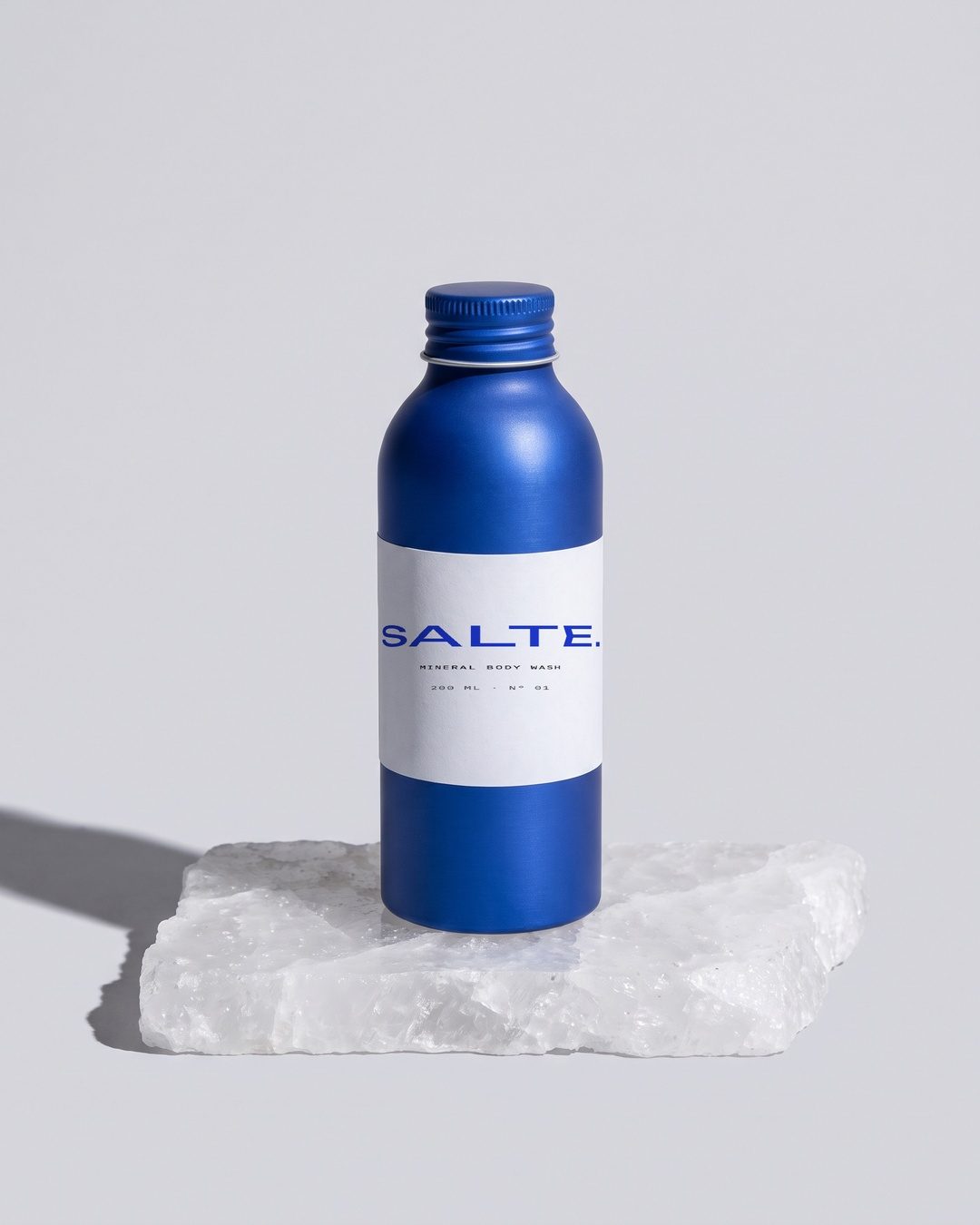 SALTE bottle on a slab of raw salt