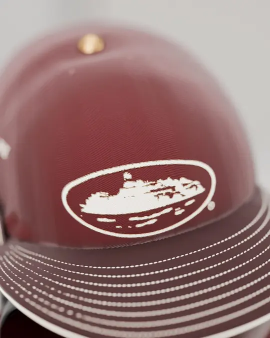 Macro of the oxblood herringbone cap with the puff Alcatraz