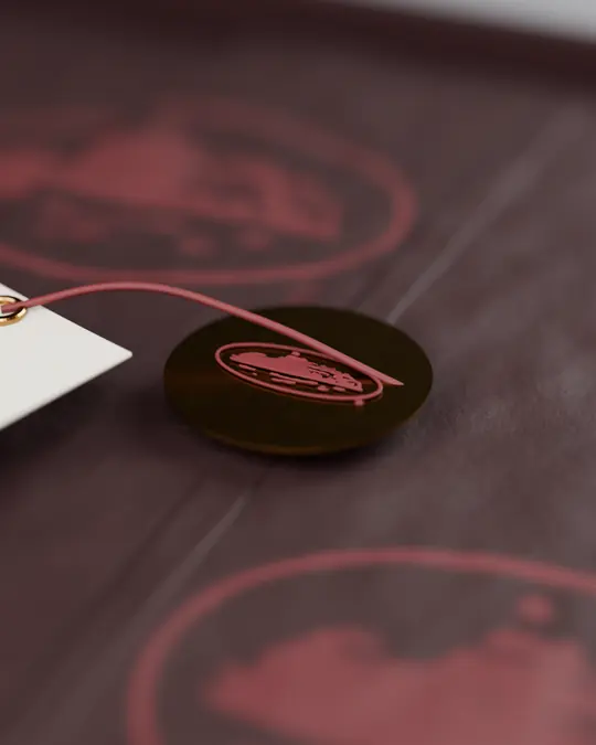 Brass seal and garnet cord on the tissue