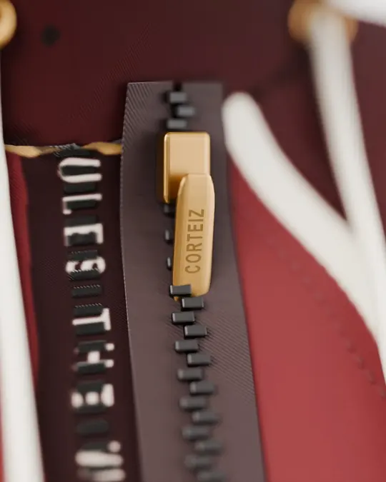 The brass zip puller engraved CORTEIZ