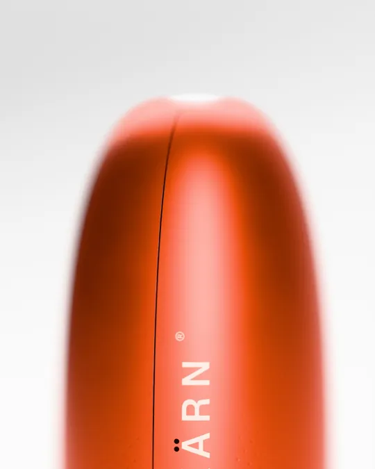 Macro: the crown, the hairline seam and the etched wordmark